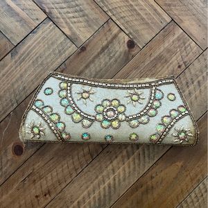 Handcrafted gold, jeweled clutch from India